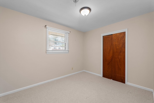 unfurnished room with carpet flooring