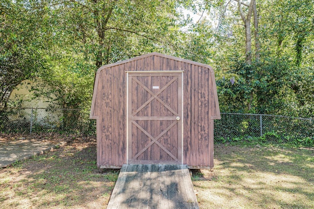 view of outbuilding with a lawn