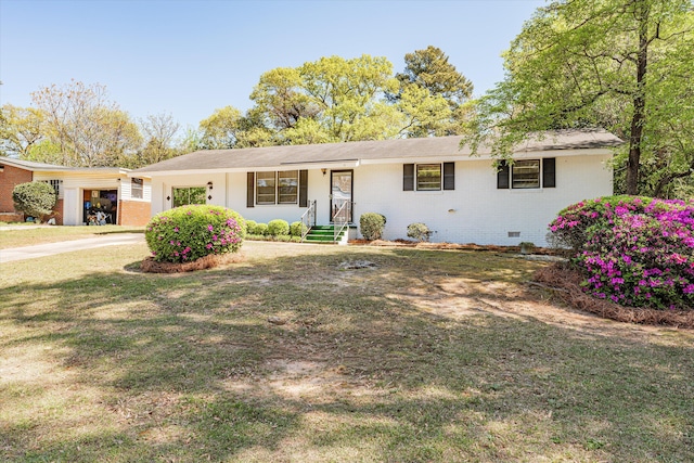 ranch-style home featuring a front yard