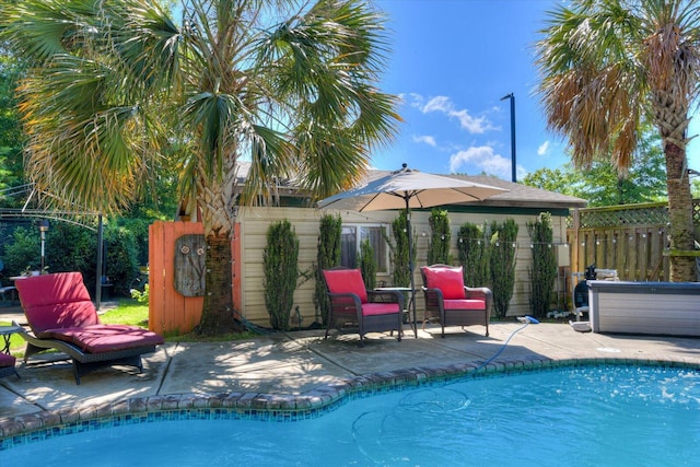 view of swimming pool with a patio area