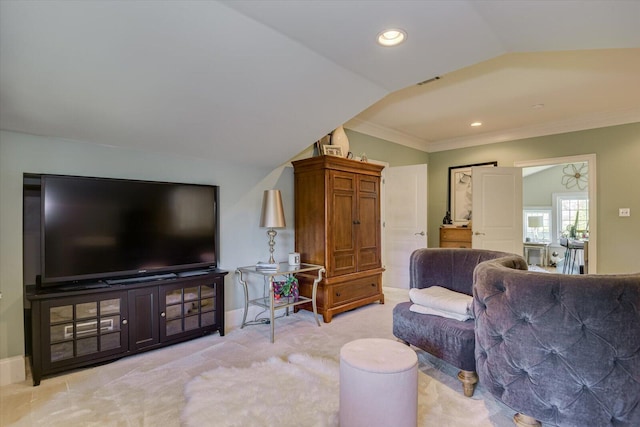 carpeted living room featuring lofted ceiling and crown molding