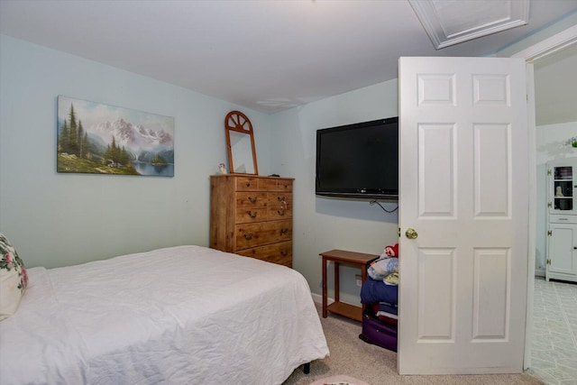 bedroom with light colored carpet