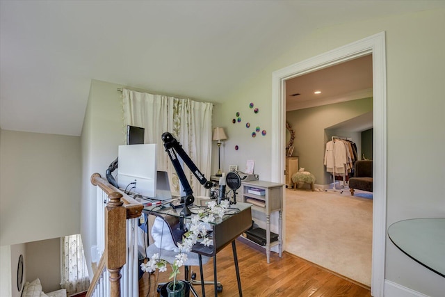 misc room with light wood-type flooring and lofted ceiling