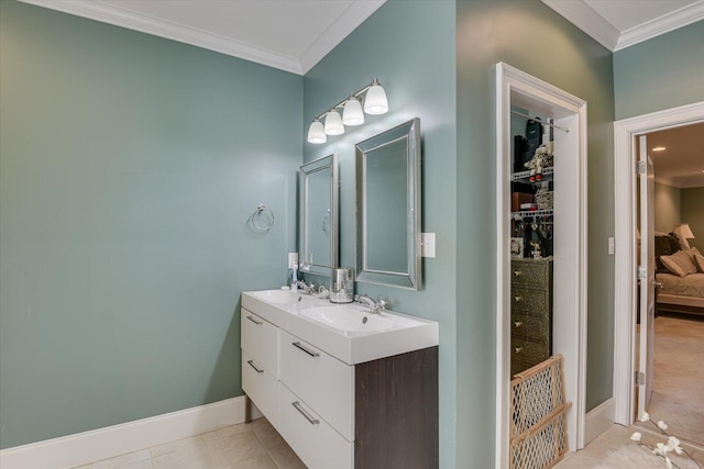 bathroom featuring vanity, tile patterned floors, and crown molding