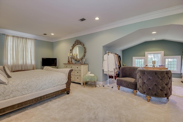 carpeted bedroom with crown molding and vaulted ceiling