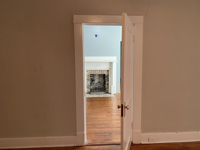 corridor featuring wood-type flooring