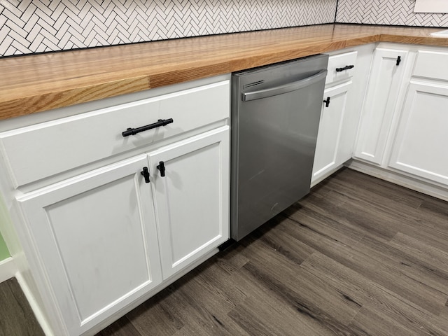 room details featuring butcher block countertops, white cabinetry, and stainless steel dishwasher