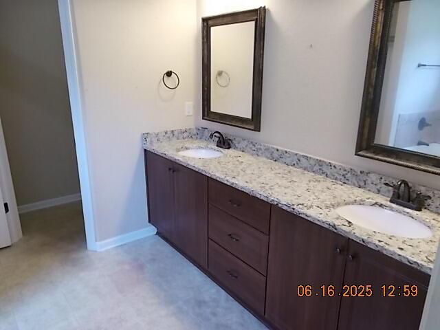437 Sebastian Dr, Grovetown, GA 30813 - bathroom featuring double vanity and baseboards