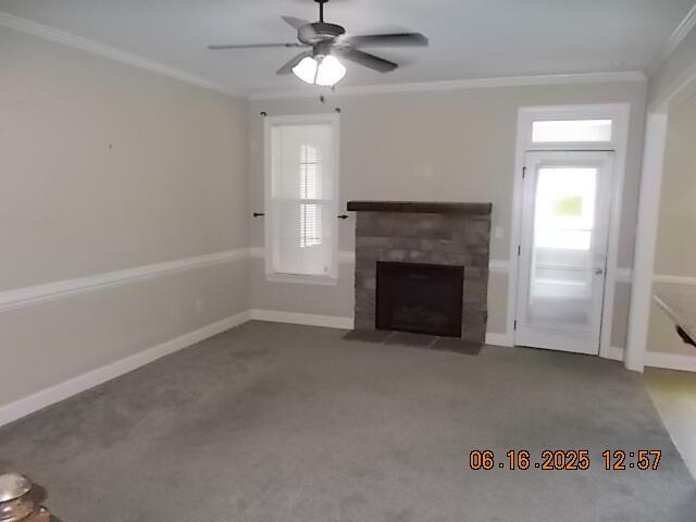 437 Sebastian Dr, Grovetown, GA 30813 - unfurnished living room featuring ornamental molding, a fireplace with flush hearth, ceiling fan, and carpet flooring