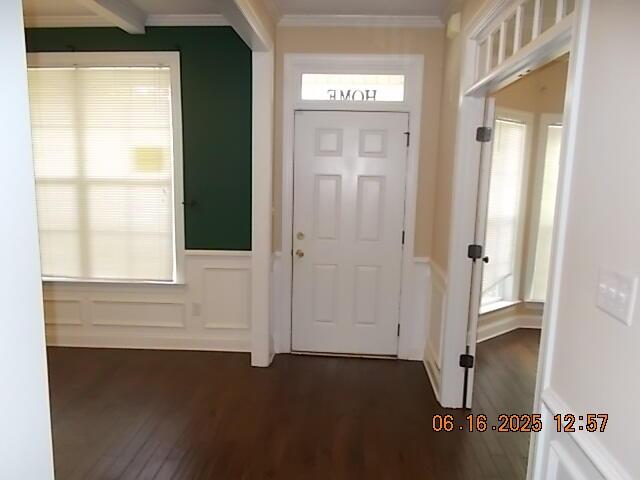 437 Sebastian Dr, Grovetown, GA 30813 - foyer entrance featuring dark wood finished floors, crown molding, wainscoting, and a decorative wall