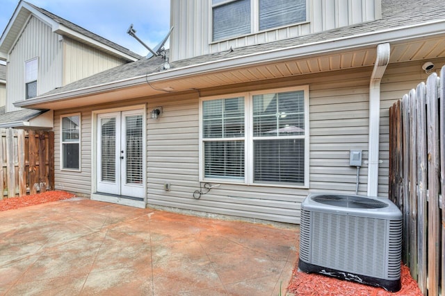 rear view of house with french doors, a patio, and central air condition unit