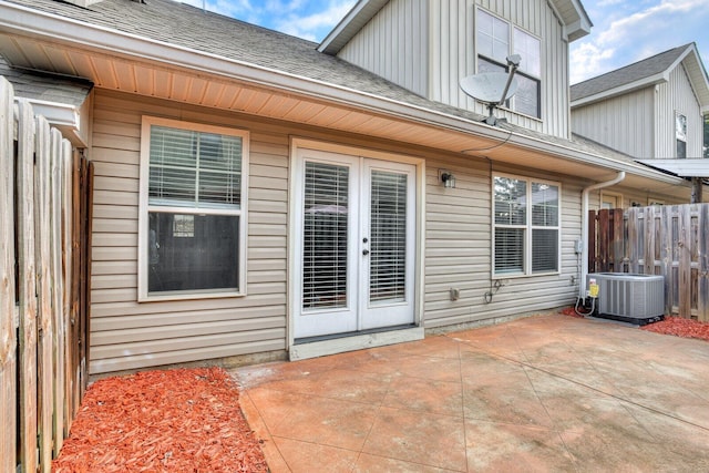 exterior space featuring central air condition unit and a patio