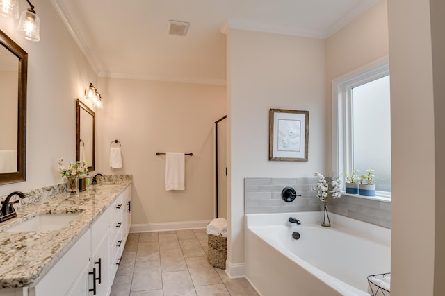 bathroom with double vanity, ornamental molding, a sink, baseboards, and a garden tub