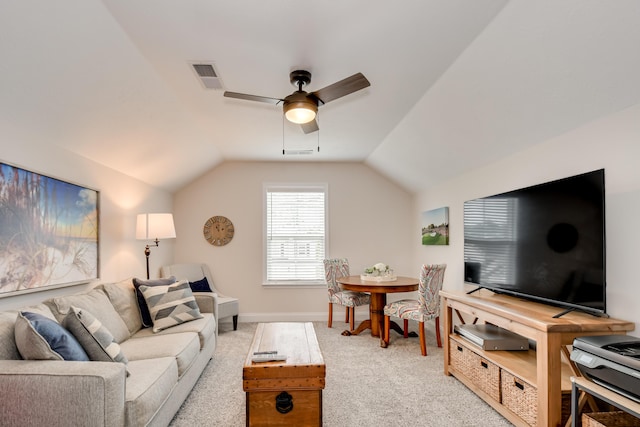 living area with visible vents, light carpet, ceiling fan, and lofted ceiling