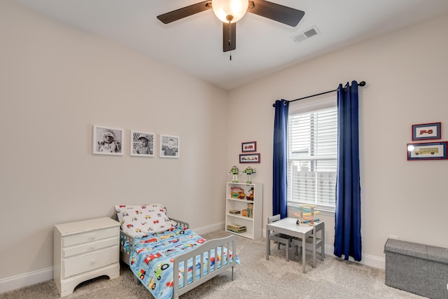 bedroom with baseboards, visible vents, and carpet floors