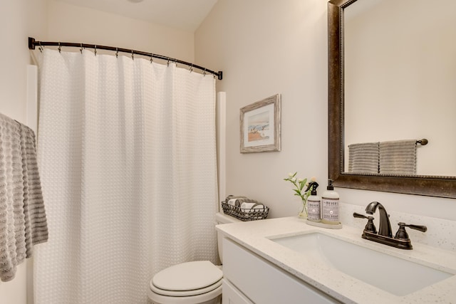 full bath featuring toilet and vanity
