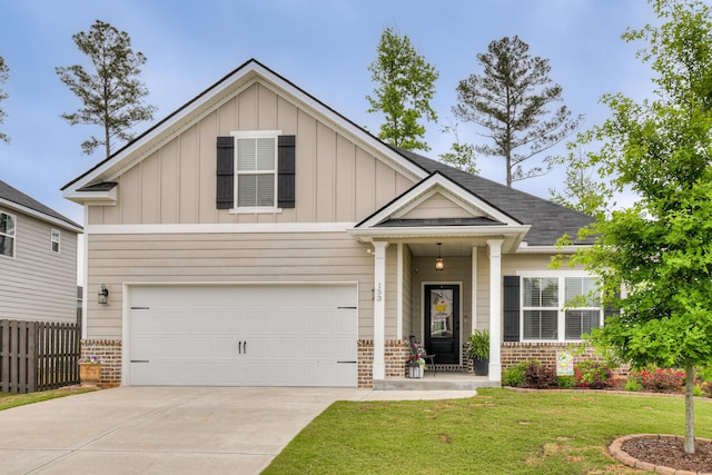 craftsman inspired home featuring brick siding, board and batten siding, and driveway