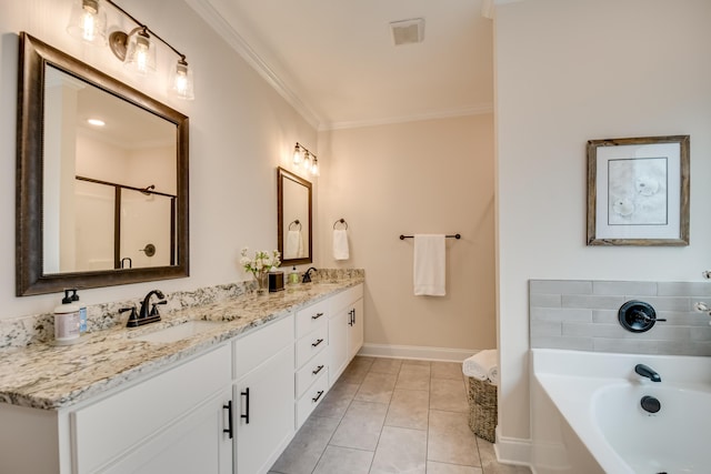 bathroom with a sink, double vanity, baseboards, ornamental molding, and a garden tub