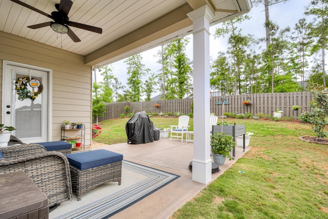 view of patio with a fenced backyard and a ceiling fan