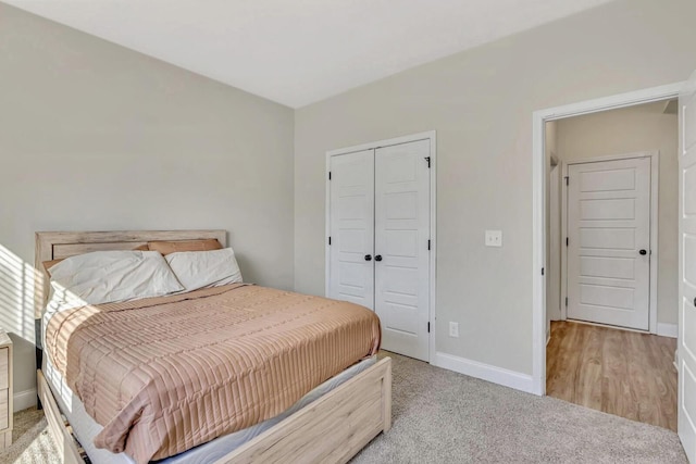 carpeted bedroom featuring a closet