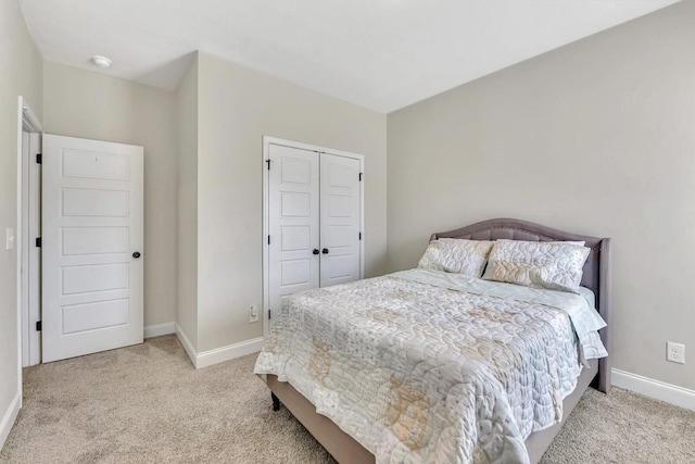 carpeted bedroom with a closet