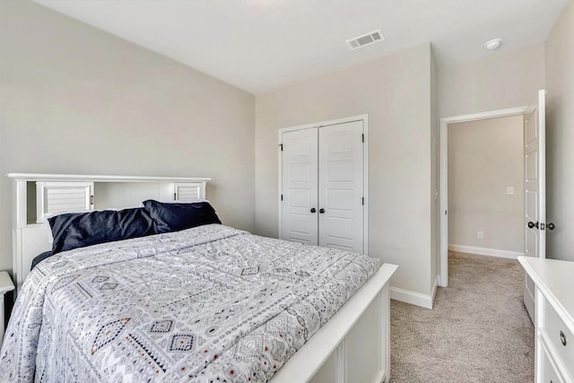 carpeted bedroom featuring a closet