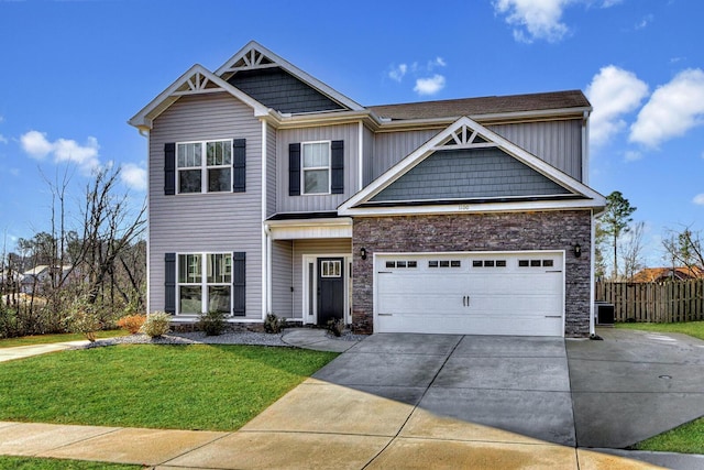 craftsman-style home featuring a garage and a front lawn