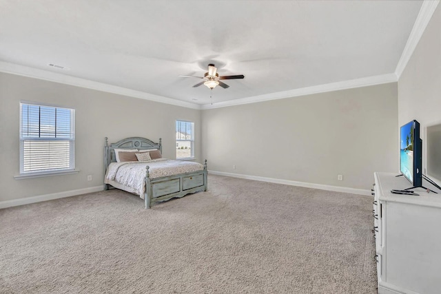 carpeted bedroom featuring crown molding and ceiling fan