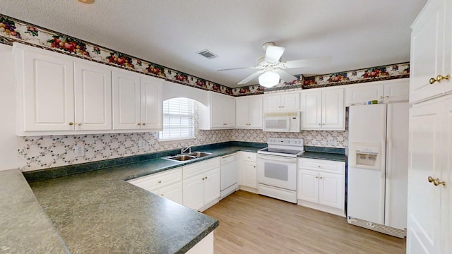 431 Connemara Trl, Evans, GA 30809 - kitchen featuring white appliances, dark countertops, a ceiling fan, white cabinetry, and light wood-style flooring
