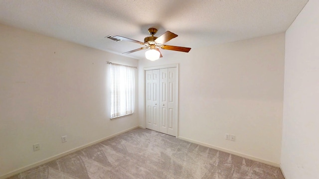 431 Connemara Trl, Evans, GA 30809 - empty room featuring light carpet, a ceiling fan, and a textured ceiling