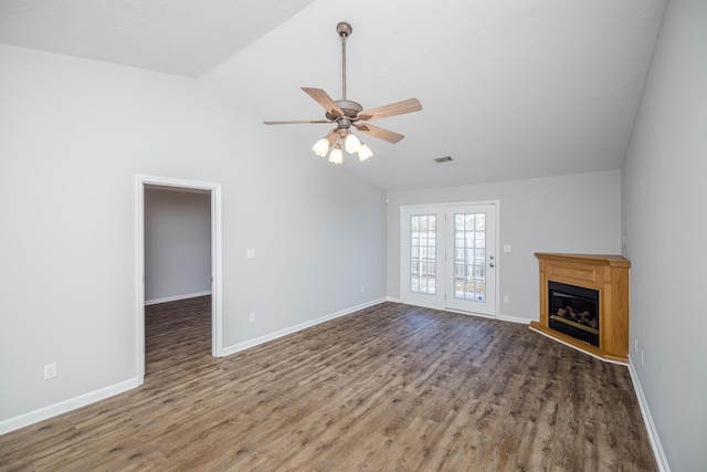 unfurnished living room with lofted ceiling, wood-type flooring, and ceiling fan