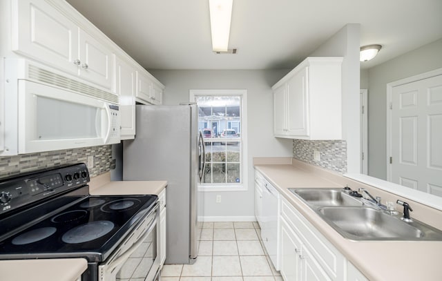 kitchen with tasteful backsplash, sink, white appliances, and white cabinets