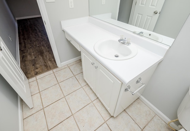 bathroom with tile patterned flooring and vanity