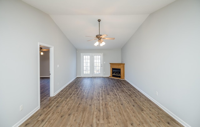 unfurnished living room with ceiling fan, lofted ceiling, and hardwood / wood-style floors