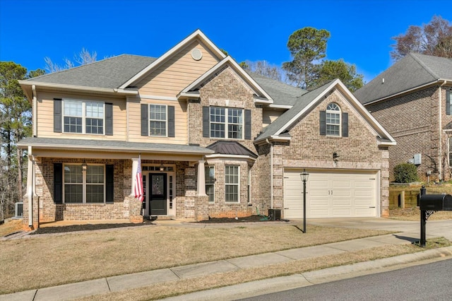 craftsman inspired home with brick siding, driveway, a garage, and roof with shingles