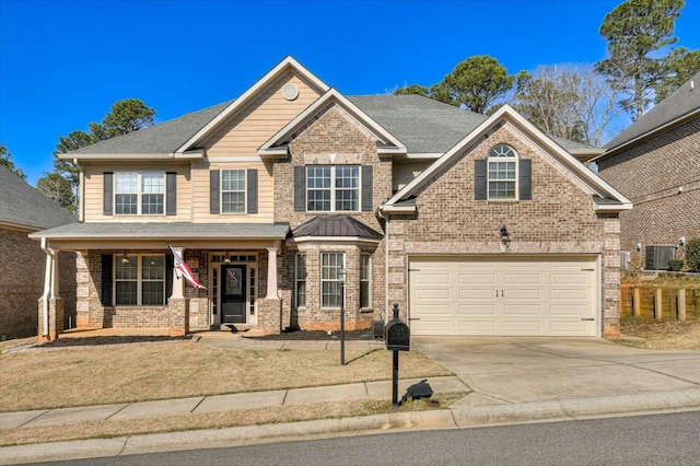 craftsman-style house with cooling unit, brick siding, a garage, and concrete driveway