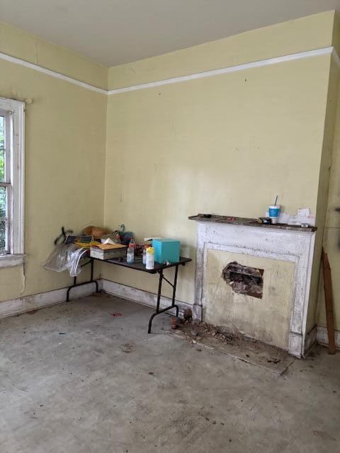 1924 Fenwick St, Augusta, GA 30904 - unfurnished living room featuring unfinished concrete floors