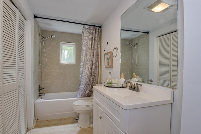 full bathroom featuring hardwood / wood-style flooring, vanity, toilet, and shower / tub combo with curtain