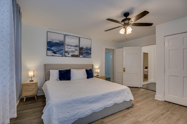 bedroom with hardwood / wood-style floors and ceiling fan