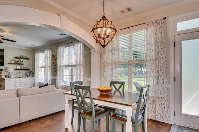 714 Neville St, Grovetown, GA 30813 - dining room with arched walkways, ornamental molding, wood finished floors, a chandelier, and a ceiling fan