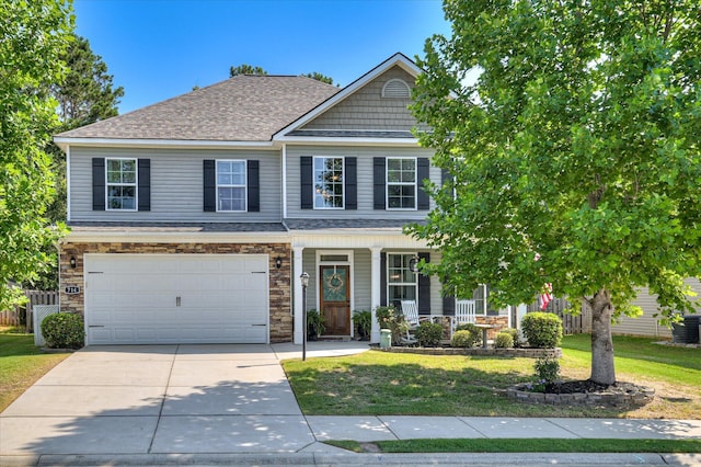 714 Neville St, Grovetown, GA 30813 - multi unit property with a front yard, a porch, concrete driveway, an attached garage, and a shingled roof