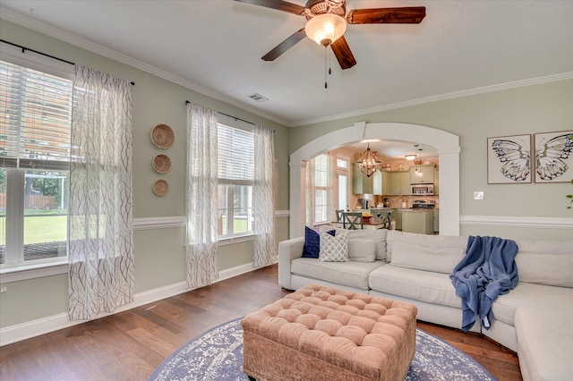 714 Neville St, Grovetown, GA 30813 - living room featuring arched walkways, a ceiling fan, ornamental molding, wood finished floors, and a chandelier