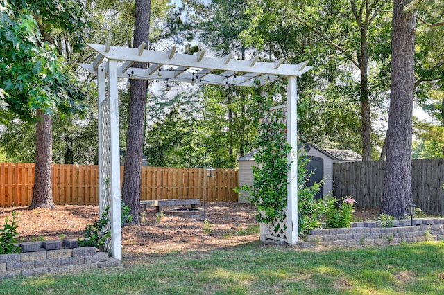 714 Neville St, Grovetown, GA 30813 - fenced backyard with a storage unit and a pergola