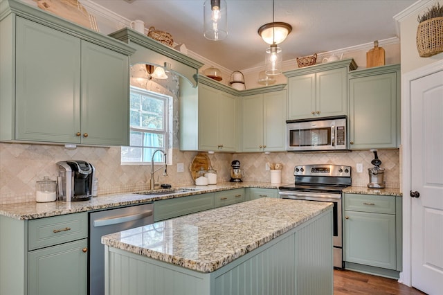 714 Neville St, Grovetown, GA 30813 - kitchen featuring appliances with stainless steel finishes, green cabinetry, ornamental molding, and dark wood finished floors