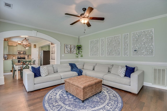 714 Neville St, Grovetown, GA 30813 - living room with arched walkways, ceiling fan, wood finished floors, ornamental molding, and a chandelier