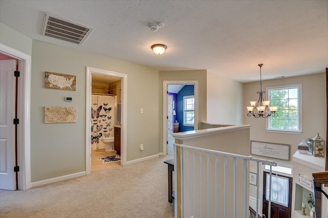 714 Neville St, Grovetown, GA 30813 - hall with an upstairs landing, light carpet, and a chandelier