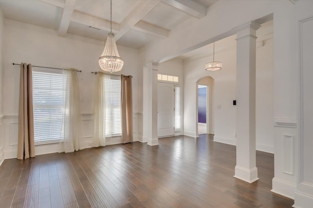 entryway featuring beam ceiling, decorative columns, dark wood-style floors, and coffered ceiling