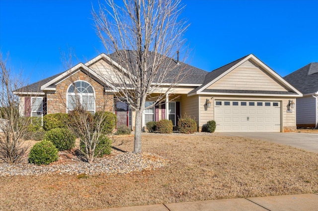 ranch-style home featuring concrete driveway, a garage, stone siding, and roof with shingles