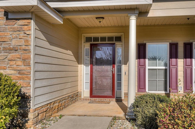 entrance to property with brick siding