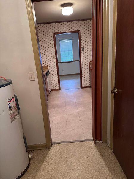 hallway with gas water heater